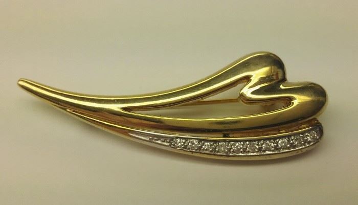 14k yellow gold pin set with 10 diamonds. Pin is 1 7/8" wide. 8.1 grams