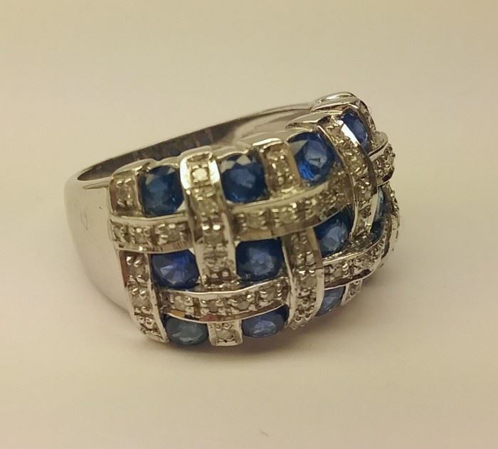 
14k white gold ring set with single cut diamonds and blue stones. Size 6 1/4. 7.7 grams
 