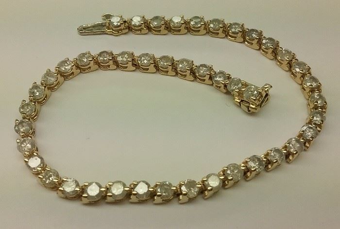 
Vintage 14k gold tennis bracelet with 44 diamonds. 9.8 grams total weight. TDW approximately 4.84 cts I-3 or worse
 