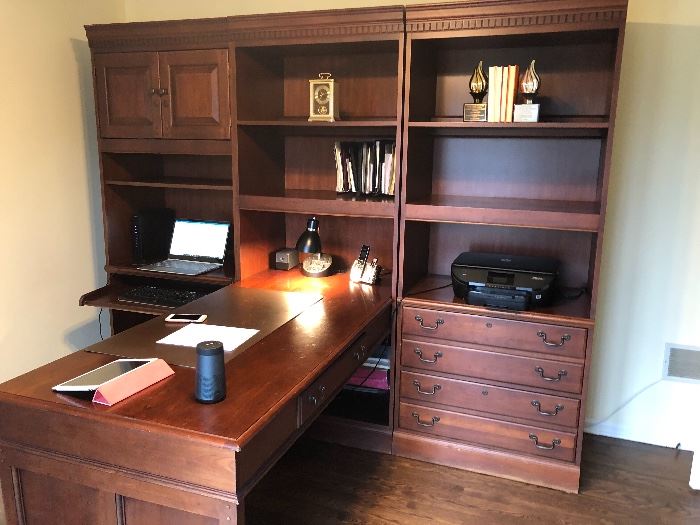 Dark wood book cases (3), desk (will separate the two end bookcases).  The middle one is actually attached to the desk.