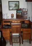 Roll-top desk, vintage slide projector and various vintage picture frames