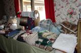 Linens including rugs, blankets, lap blankets, bedspread and sheets, afghans, table cloths and napkins.