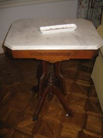 One of 2 small marble topped Eastlake tables