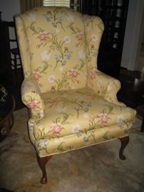 One of a pair of floral wing back chairs