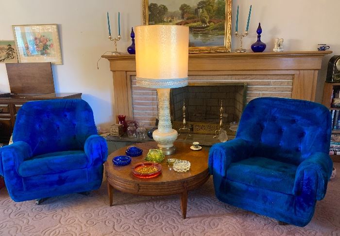 A pair of vintage Light cobalt blue swivel chairs.