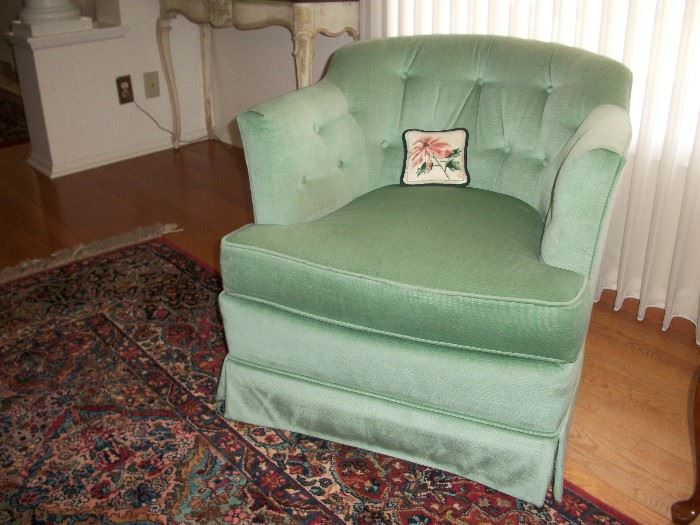 Pair of swivel chairs in seafoam color.
