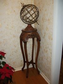 Ornate globe.  Carved fern stand