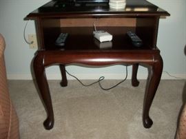 Small mahogany looking television stand.