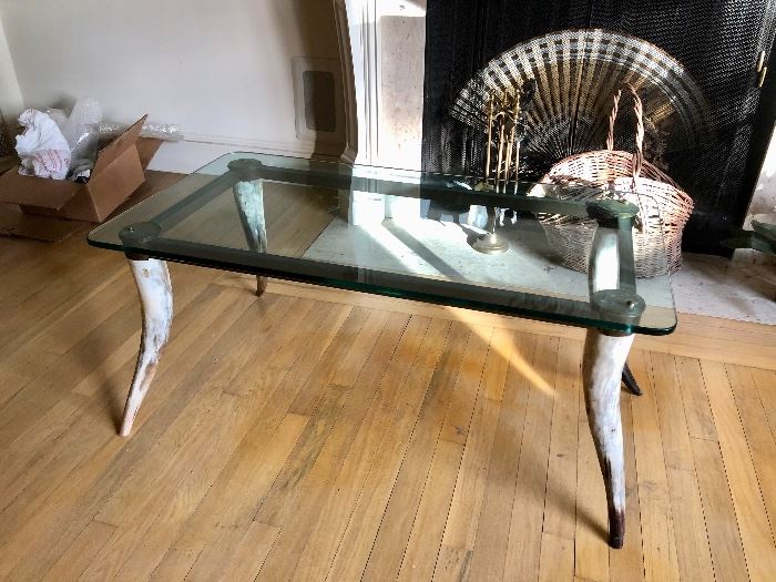 Glass top coffee table with Steer Horn legs 