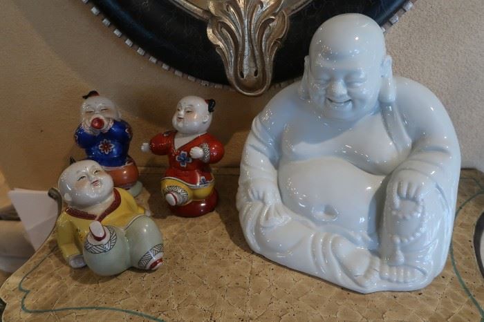 The white Buddha is a bank.  The three boys are adorable!