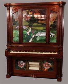CLARENDON HADEROFF PIANO CO., CARVED MAHOGANY UPRIGHT PIANO/NICKELODEON, C. 1911, H 78", L 60", D 27", INSET WITH FIGURAL LEADED GLASS, Lot 84