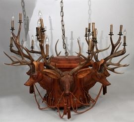 MANSION SIZE CARVED WOOD DEER HEADS AND LEATHER CHANDELIER, H 41", DIA 56" Lot 1017