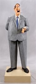 STEPHEN HANSEN (AMERICAN, B. 1950), PAPIER-MACHE SCULPTURE, "FINAL OFFER 1989", H 58.5", W 22", D CA. 20"  Lot 2210