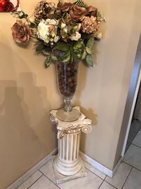 floral arrangement and pedestal