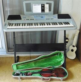 Sharper Image electric piano. Violin in need of tlc-no name