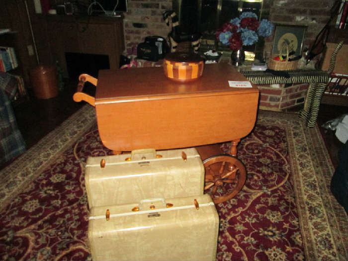 Wooden cart and vintage luggage