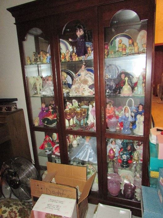 collemction of dolls, Hummel figurines, and Fenton