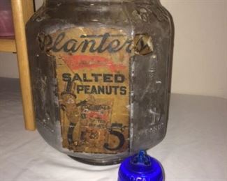 Old Planters jar and vintage glass advertising paperweight by Missouri and Kansas Telephone