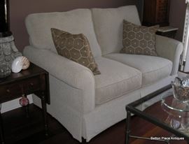 As new Loveseat, this is excellent, 64 inches wide, 38 inches deep.