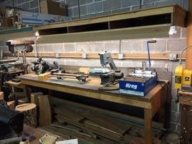 Here is another nice shop table. It is 3'2" deep x 10'1" long. Note the two sheets of steel behind the table. More details in further photos.