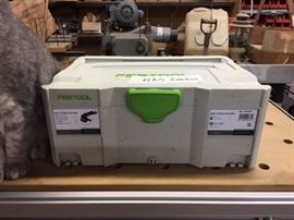 Another stackable box with power tool inside.