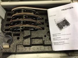 Details from the manufacturer: 
The FESTOOL OF 2200 Accessory Kit in imperial dimensions, contains eight different accessories for multiple applications. Each base snaps onto the router without the need for tools, so saving you time, as opposed to having to use tools to install bases. The kit contains Festool imperial components of standardized sizes. This carrying case has stackable nesting boxes which permit easy location of the accessory that you need. Using the Festool guide rods allows you to make exact cuts with every pass.