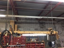 Overhead shelf suspended from the girders.