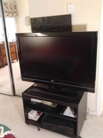 One of two flat screen TVs for sale
