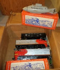 vintage Lionel Trains, engines, tracks.  Lionel Commando-Submarine  US Navy 3830
Caboose #6257
flatbed car (blue) #6511-2
flatbed car (red) #6511-2
Lionel Transformer type 1073, 60 watts/120 volts, 8-18 volts switch
Lionel model #147 Controller
aerial target launching car # 3570-22
missile firing trail car #6544-10
Santa Fe Engine BLT 8-52 (2 available)
Coal Car Lehigh Valley built I-48 Lionel 6076
Qty of both straight & curved track