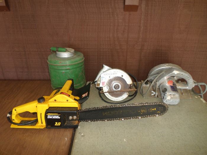 very vintage green cooler, chain saw & a couple skill saws