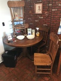 Vintage oak round pedestal table with 4 oak chairs.