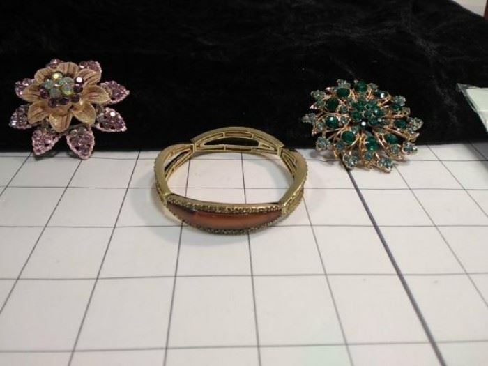Monet gold bracelet and two broaches   https://ctbids.com/#!/description/share/86453