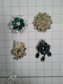 Two vintage teal and blue crystal brooches https://ctbids.com/#!/description/share/86472