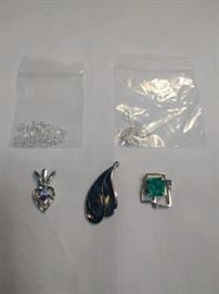 3 miscellaneous pendants and two pendant chains https://ctbids.com/#!/description/share/86395