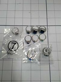 Lot of 10. Size 7, 8, unmarked: silver banded rings with various blue jewels  https://ctbids.com/#!/description/share/86431