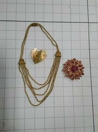 Vintage gold multi-strand neclace, gold lacey heart pin, and pink crystal brooch               https://ctbids.com/#!/description/share/86475