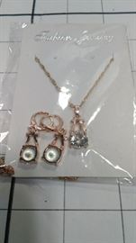 3 piece rose gold colored set: Ring , earrings , necklace https://ctbids.com/#!/description/share/86422