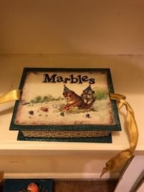 Antique marble box with marbles ties with ribbons