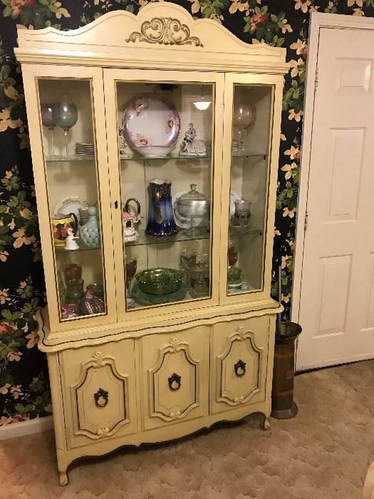 Lighted china cabinet with two glass shelves and storage below