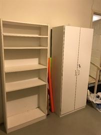 Closed white cabinet and one of three white book cases