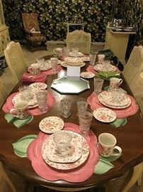 Dining table set with Johnson Bros. Chintz Pink china, flower placemats, Wexford glassware