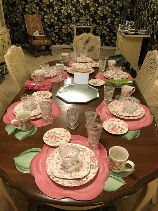Dining table set with Johnson Bros. Chintz Pink china, flower placemats, Wexford glassware