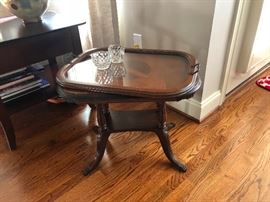 antique end table with glass tray top