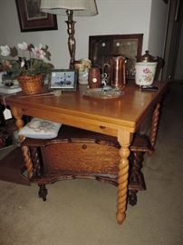 This table EXTENDS ...shown with knick-knacks and a very interesting barley twist side table. 