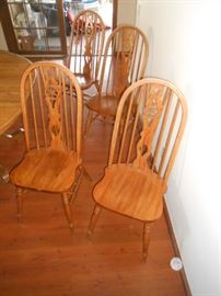 4 arched oak chairs