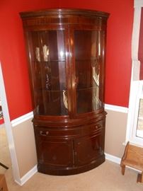 This is a beautiful corner cabinet 2/glass doors, 1/drawer and 2 bottom doors