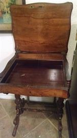 Antique sewing table with drawers.