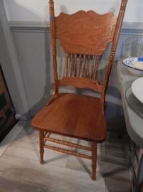 Oak chair... One of three found. Oak table in kitchen to match.