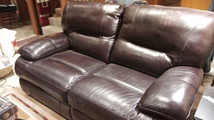 Dual controls leather recliner  64" wide x fully extended 62" deep and 38" tall