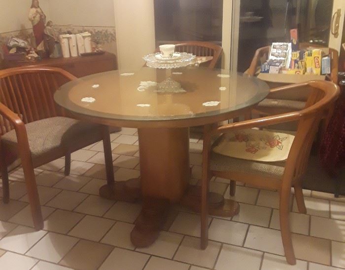 Pedestal table with glass top. Maple, cushions need recovering but the seat structure is solid. 